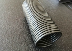 Tilt door spring